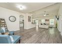 Spacious living room with wood floors, stylish furniture, and ample natural light at 409 Carousel Ct, Summerville, SC 29483