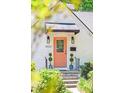 Inviting front door with awning and decorative plantings, enhancing the home's curb appeal at 4503 Overbrook Ave, North Charleston, SC 29405