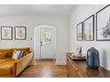 Bright living room features hardwood floors, statement art and neutral walls at 4503 Overbrook Ave, North Charleston, SC 29405