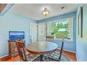 Cozy dining area with a round wood table, perfect for intimate meals at 4942 Storage Rd, Meggett, SC 29449