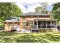 Home exterior featuring a white deck, screened porch, and large backyard at 501 Willow Branch Way, Mount Pleasant, SC 29464