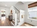 Bright entryway with hardwood floors, white walls, coat hooks, and a wooden cabinet at 518 Sound Dr, Summerville, SC 29486