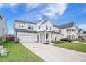 Beautiful curb appeal with a long driveway and an inviting front yard, highlighting the home's architecture at 533 Richfield Way, Summerville, SC 29486