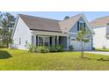 Charming home featuring a two-car garage and well-manicured front lawn at 603 Yellow Leaf Ln, Summerville, SC 29486
