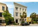 This three-story home features gorgeous architectural details and is conveniently located next to downtown Charleston at 62 Society St, Charleston, SC 29401
