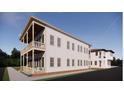 Two-story home with double porch, complemented by the adjacent building at 63 Montagu St, Charleston, SC 29401