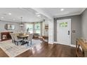 Open concept dining room featuring hardwood floors and lots of natural light at 699 Castle Pinckney Dr, James Island, SC 29412