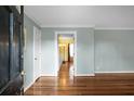 Inviting entryway with freshly painted walls, hardwood floors, and elegant trim work at 702 Minus St, Saint George, SC 29477