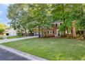Spacious lawn complements this brick home, complete with an attached garage and a long driveway at 103 Sylvan Ter, Summerville, SC 29485