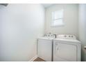 Functional laundry area with modern appliances, including a white washer and dryer set at 110 Green Passage Ln, Summerville, SC 29486