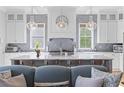 Luxurious kitchen with stainless steel appliances, marble countertops, and stylish pendant lighting at 112 Berkshire Dr, Wando, SC 29492