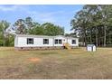 Home with a well-manicured lawn and charming outdoor shed at 119 Silver King Ave, Cross, SC 29436