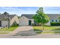 Charming single-Gathering home featuring a well-manicured lawn and an attached garage in a lovely neighborhood at 121 Keaton Brook Dr, Summerville, SC 29485
