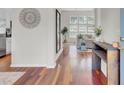 Inviting foyer featuring hardwood floors and an elegant console table at 1634 Pin Oak Cut, Mount Pleasant, SC 29466