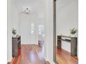 Welcoming foyer featuring hardwood floors and a decorative mirror at 1634 Pin Oak Cut, Mount Pleasant, SC 29466