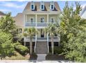 Inviting two-story home with a double porch, perfect for enjoying the outdoors at 1658 Pierce St, Charleston, SC 29492