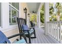 Relaxing porch with comfortable rocking chairs, ideal for enjoying peaceful moments at 1658 Pierce St, Charleston, SC 29492