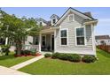 Charming home featuring a cozy porch and gray siding, set in a well-maintained landscape at 1722 Winfield Way, Charleston, SC 29414