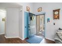 Bright foyer featuring hardwood floors, light blue trim, and an inviting atmosphere at 203 Eagle Ridge Rd, Summerville, SC 29485