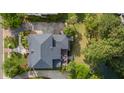 An aerial view shows a private backyard deck with outdoor seating and mature trees at 2645 Crooked Stick Ln, Mount Pleasant, SC 29466