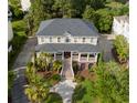 Beautiful home with a circular driveway, mature trees, and manicured landscaping at 2645 Crooked Stick Ln, Mount Pleasant, SC 29466