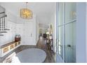 Inviting home foyer with a custom coat rack, hardwood floors, and an elegant light fixture at 2924 Tranquility Rd, Mount Pleasant, SC 29466