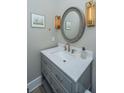 Elegant powder room with a marble countertop, stylish fixtures, and decorative accents at 3635 Pandora Dr, Mount Pleasant, SC 29466