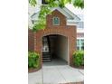 Brick archway entrance with unit number signage and staircase access at 45 Sycamore Ave # 811, Charleston, SC 29407