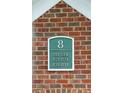 Close-up of brick wall with unit numbers sign for the building's residences at 45 Sycamore Ave # 811, Charleston, SC 29407