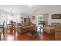 Bright and airy living room featuring hardwood floors and comfortable seating at 4856 Carnoustie Ct, Summerville, SC 29485
