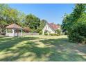 Exterior of house with large yard, gazebo, and mature landscaping at 5615 Highway 165, Ravenel, SC 29470