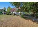 View of the attractive property and gazebo with lush landscaping around the yard at 5615 Highway 165, Ravenel, SC 29470