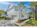 This inviting two-story home boasts a side entry garage, a covered front porch, and freshly landscaped flowerbeds at 5655 Captain Kidd Rd, Hollywood, SC 29449