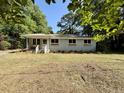 Inviting single-story home with newly updated windows and a tidy landscaped front yard at 6086 Chisolm Rd, Johns Island, SC 29455