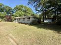 Attractive one-story home with well-maintained lawn and a detached storage shed at 6086 Chisolm Rd, Johns Island, SC 29455
