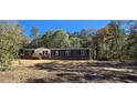 Charming single-story home surrounded by mature trees at 945 Tiger Loop, Saint Stephen, SC 29479