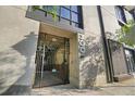 Close-up of the secure building entrance with decorative iron gate and unit numbers at 1 Cool Blow St # 337, Charleston, SC 29403