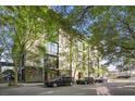 Modern building featuring lush trees surrounding the entry with convenient street parking at 1 Cool Blow St # 337, Charleston, SC 29403