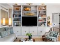Bright living room featuring beautiful built-in shelving perfect for storage and displaying decor at 1 King St # 501, Charleston, SC 29401