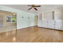 Bright living room featuring hardwood floors, neutral paint, and built-in cabinets and shelving at 1143 Winborn Dr, Charleston, SC 29412