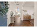 Elegant foyer featuring hardwood floors, stylish decor, and an open view into the living area at 142 Lucca Dr, Summerville, SC 29486