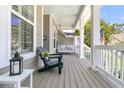 Inviting front porch with comfortable seating and a porch swing, ideal for relaxing outdoors at 1733 James Basford Pl, Mount Pleasant, SC 29466
