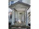Inviting front porch with columns and the house number '217' adding to its charm at 217 Scotia St, McClellanville, SC 29458
