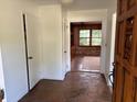 Inviting foyer with natural stone flooring leading to a bright and airy living space at 2331 Furman Dr, Charleston, SC 29414