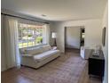 Comfortable living room with a plush sofa, accent chair, and lots of natural light at 2331 Furman Dr, Charleston, SC 29414