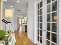 Open foyer featuring hardwood floors and modern lighting fixtures at 2524 Josiah St, Charleston, SC 29492