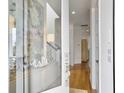 Bright foyer with hardwood floors, staircase, and views of the living space at 2524 Josiah St, Charleston, SC 29492