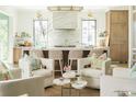 Bright, open kitchen featuring a large marble island, counter seating, and modern finishes at 2538 Helmsman Rd, Johns Island, SC 29455