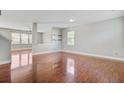 Open concept living area with hardwood floors, recessed lighting, and a neutral color palette at 330 Albrighton Way, Moncks Corner, SC 29461