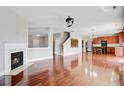 Bright, open-concept living area features a fireplace, hardwood floors and a seamless flow into the kitchen at 330 Albrighton Way, Moncks Corner, SC 29461